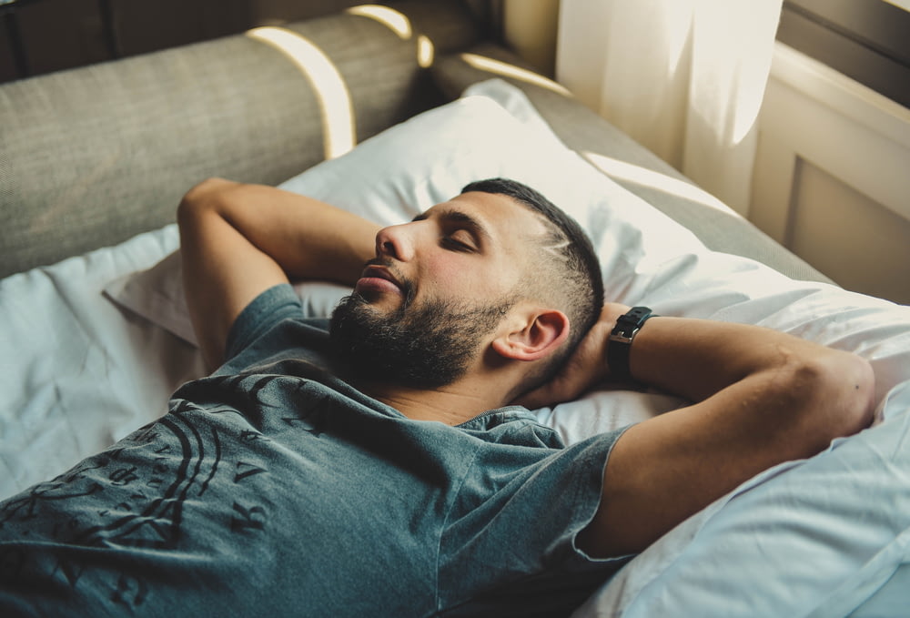 man lying on bed