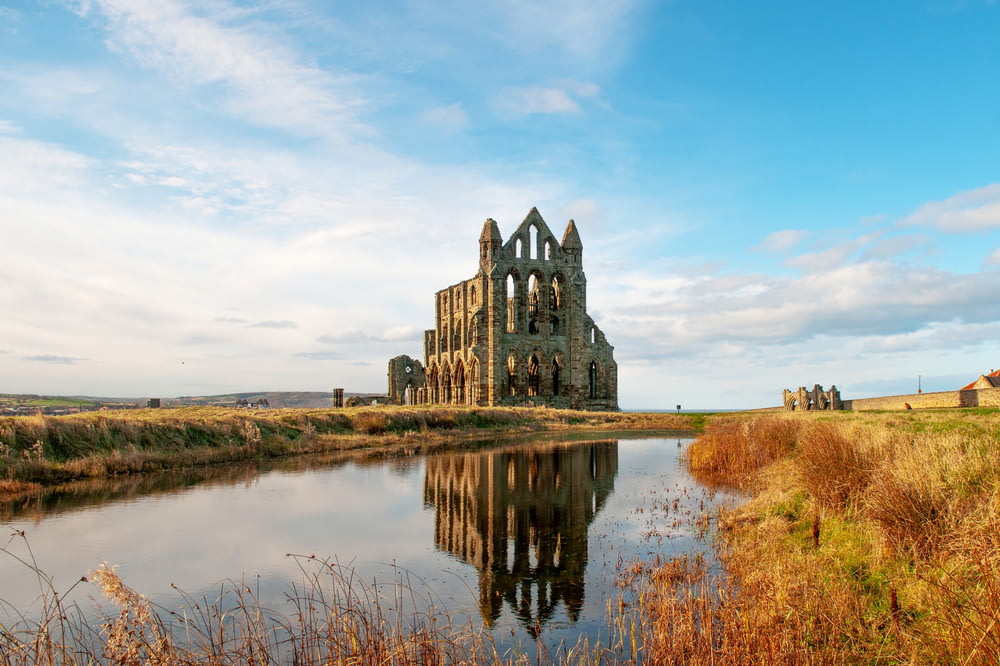 Whitby Abbey in England under white and blue sky