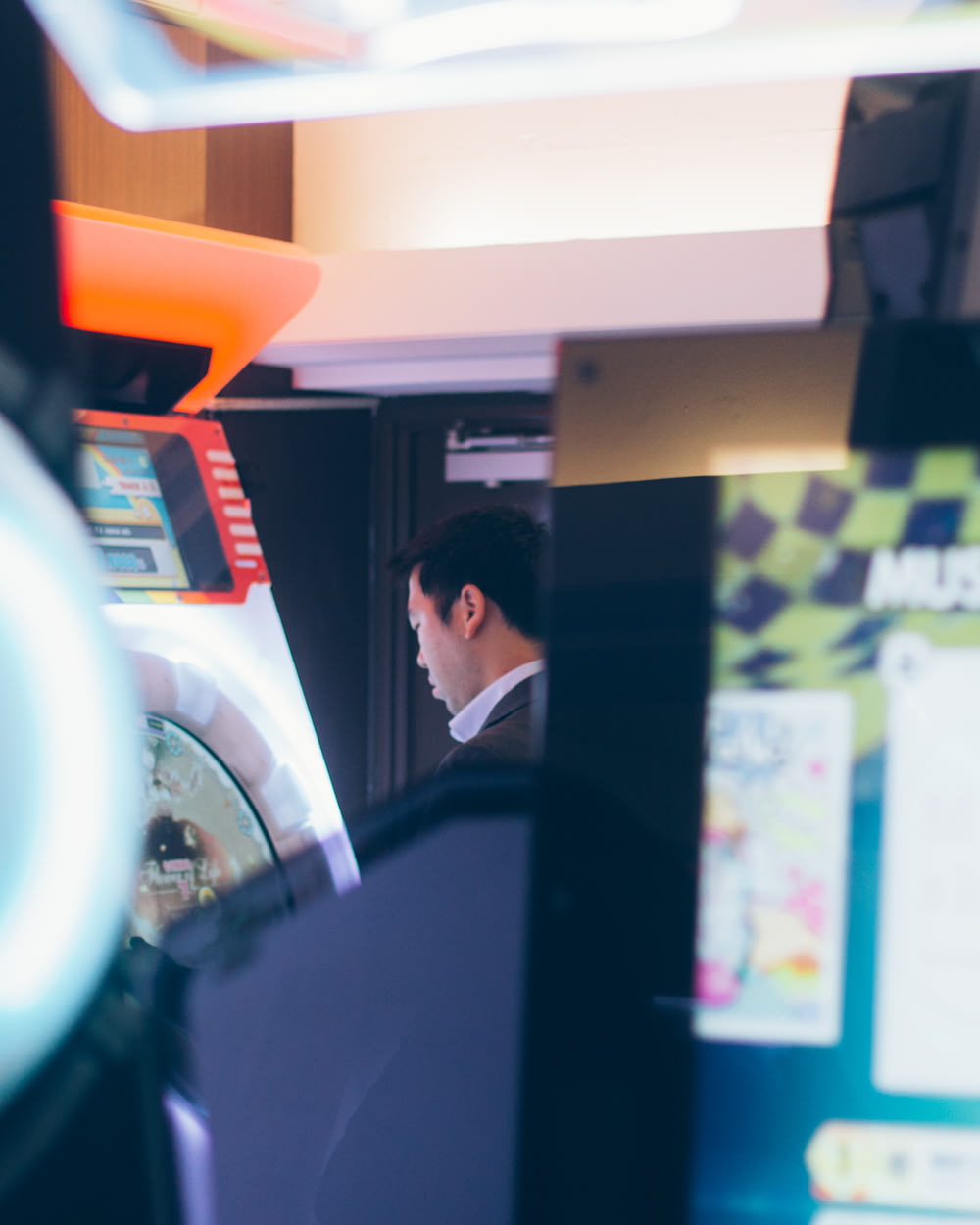 man facing game arcade machine