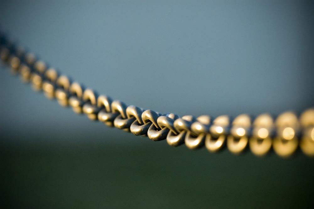 tilt shift photography of gray steel chains