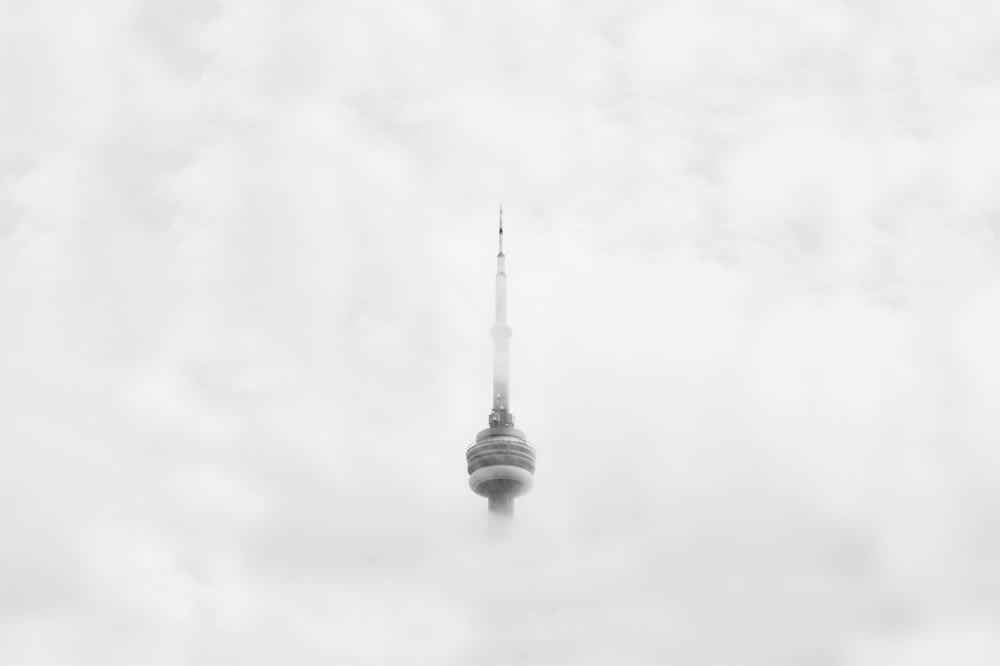 CNN Tower in Canada surrounded by clouds