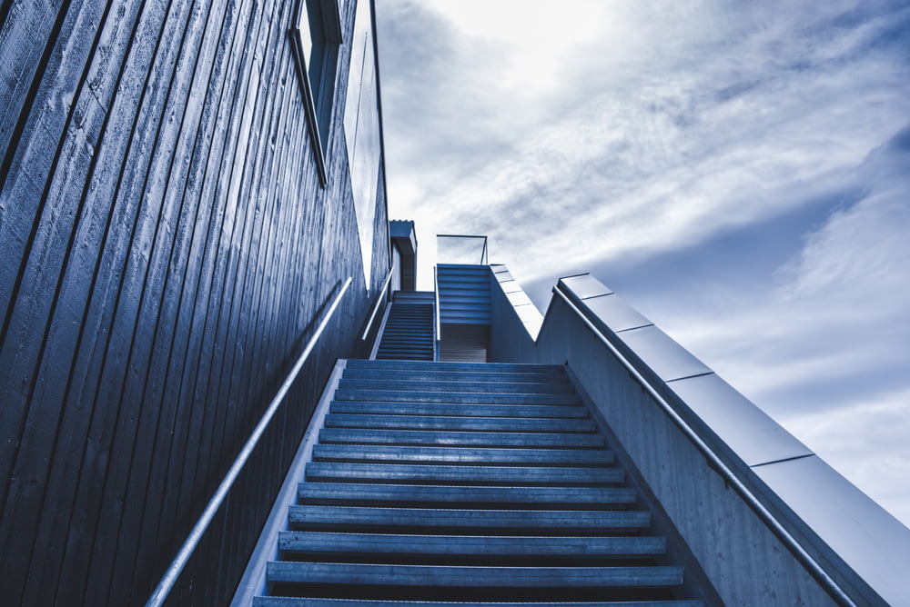 photo of staircase under blue sky during daytime