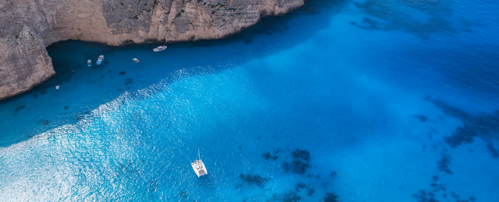 boat on body of water in aerial photography