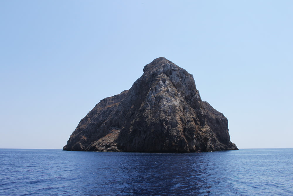 black mountain on sea