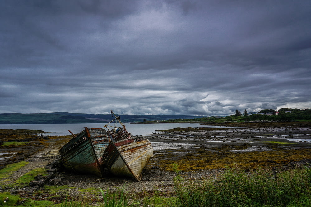 landscape photography of two boats near body of water