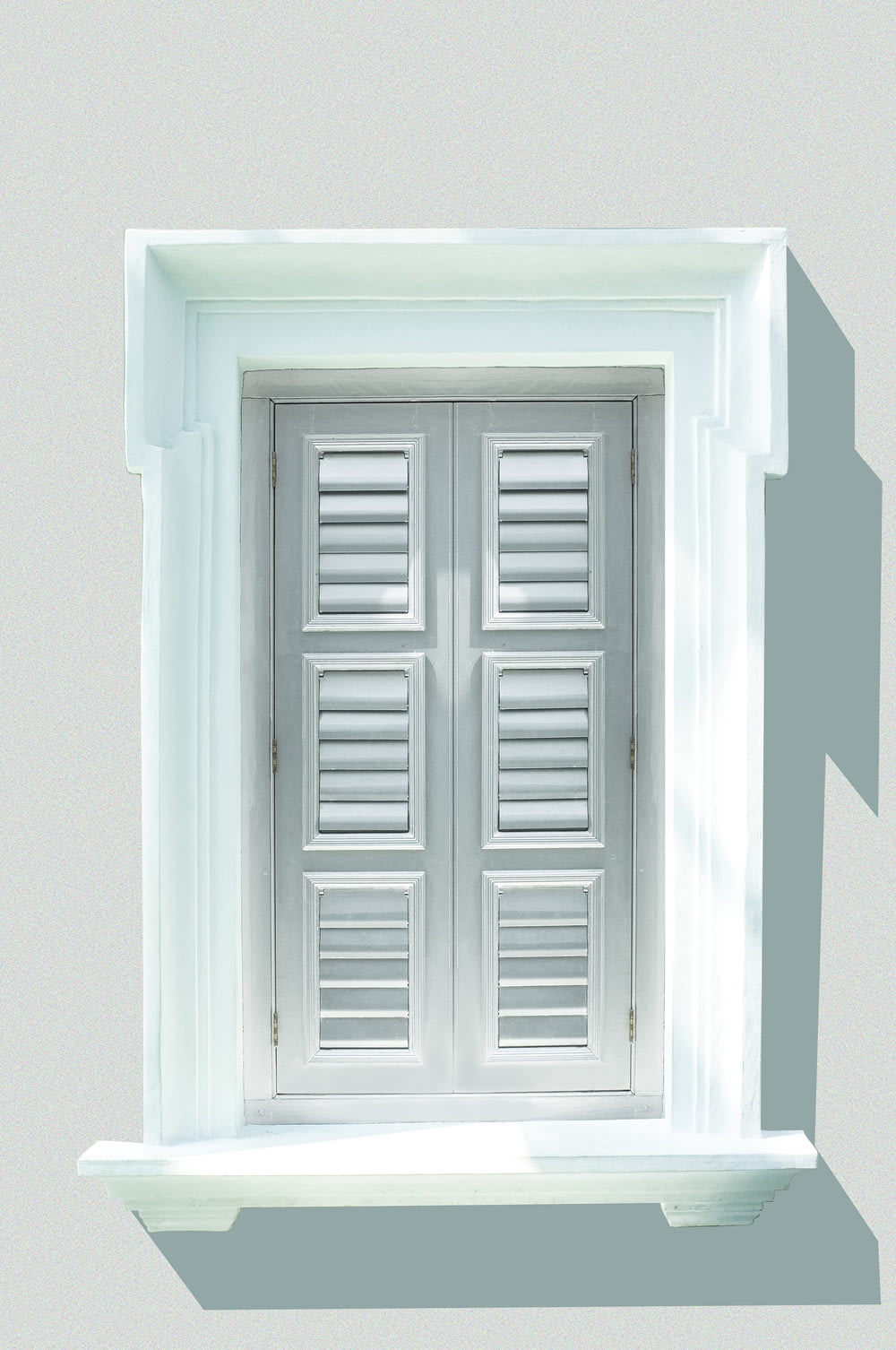 white wooden window shutter