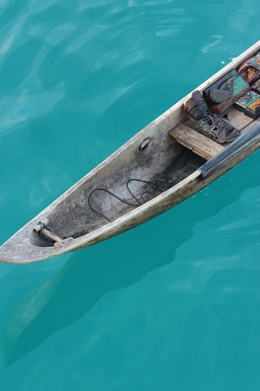 tribal mask on brown boat