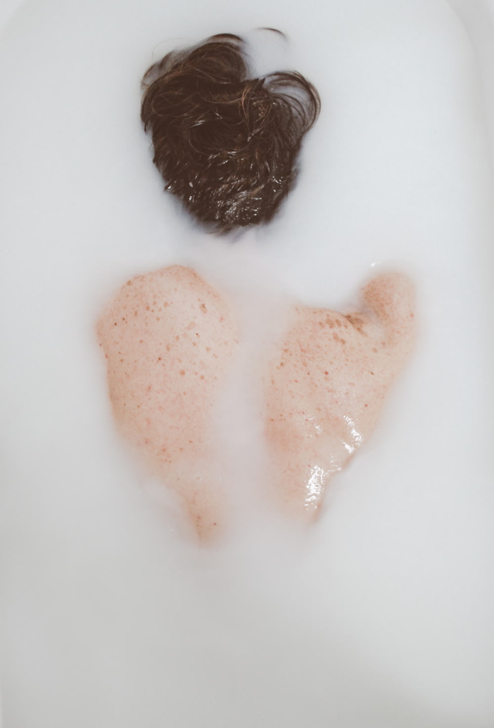 a couple of pieces of meat in a bath of water