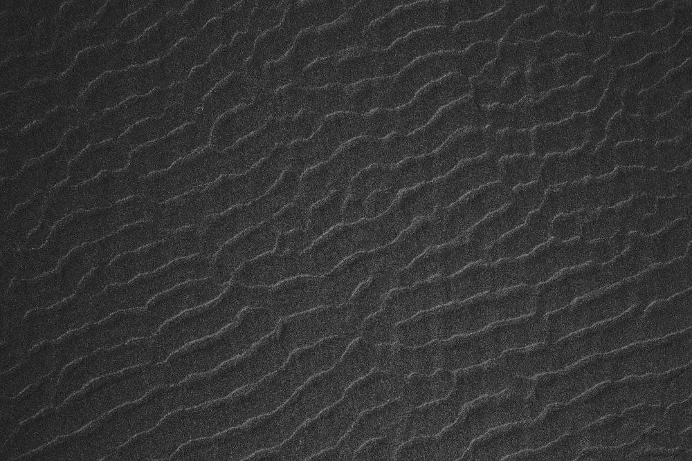 a black and white photo of a textured surface
