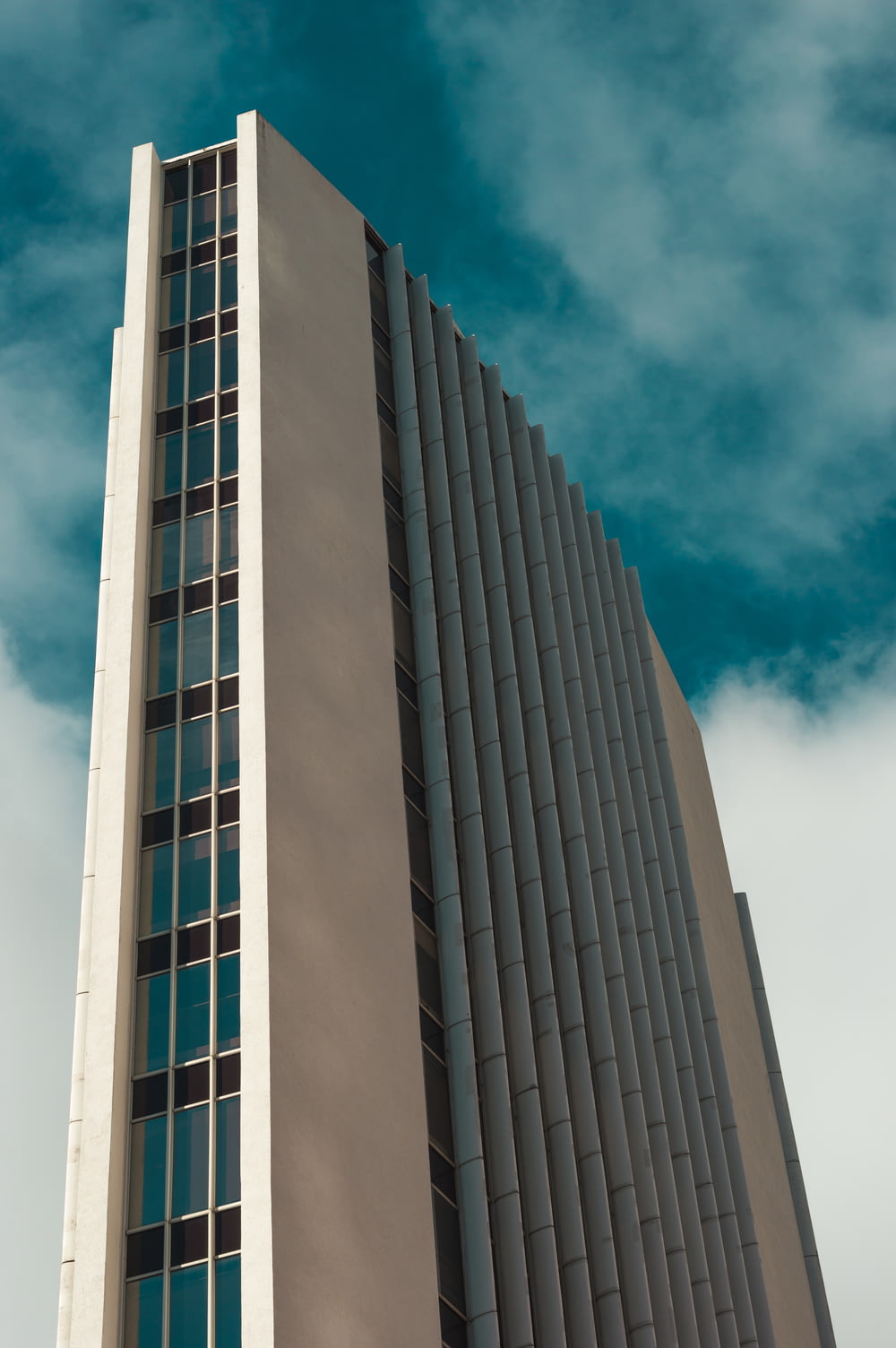low angle photography of multi-story high rise building during daytime