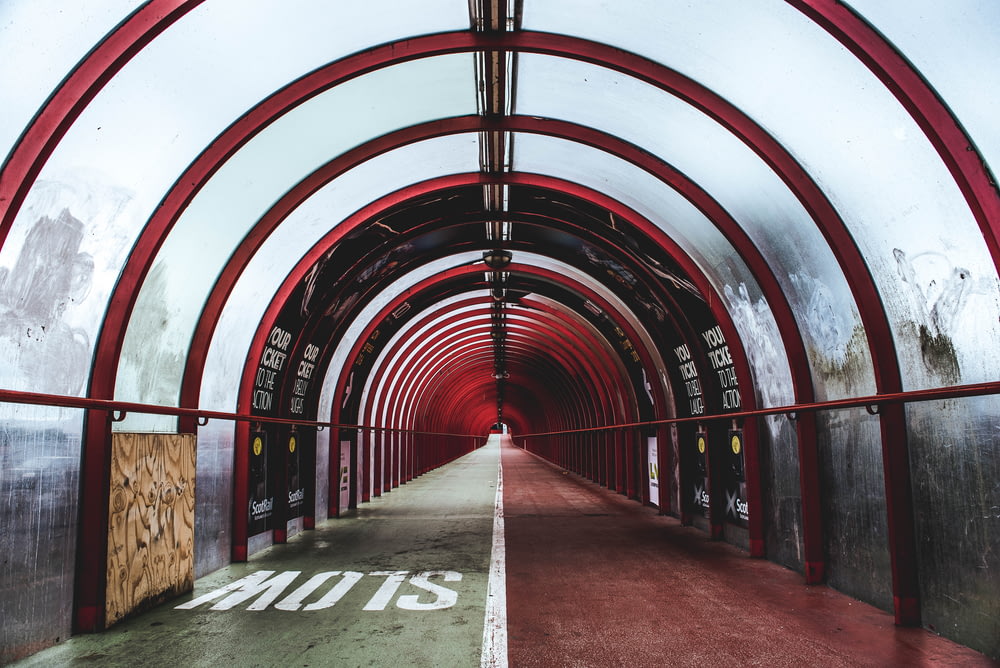 empty red and white glass tunnel