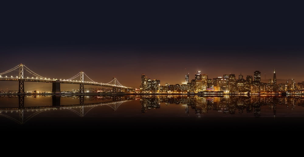 cityscape photography of lighted city with bridge