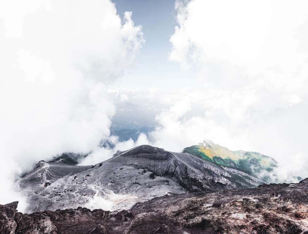landscape photography of mountain surrounded by clouds