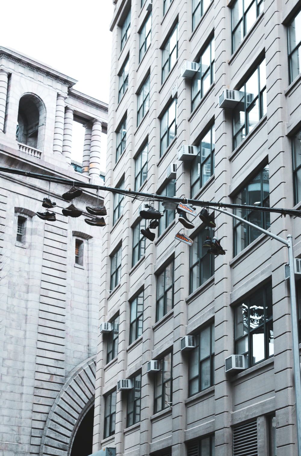 shoes hanging on street pole
