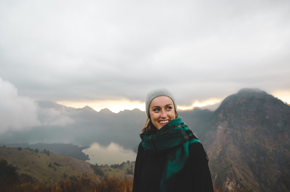 woman wearing green scarf smiling