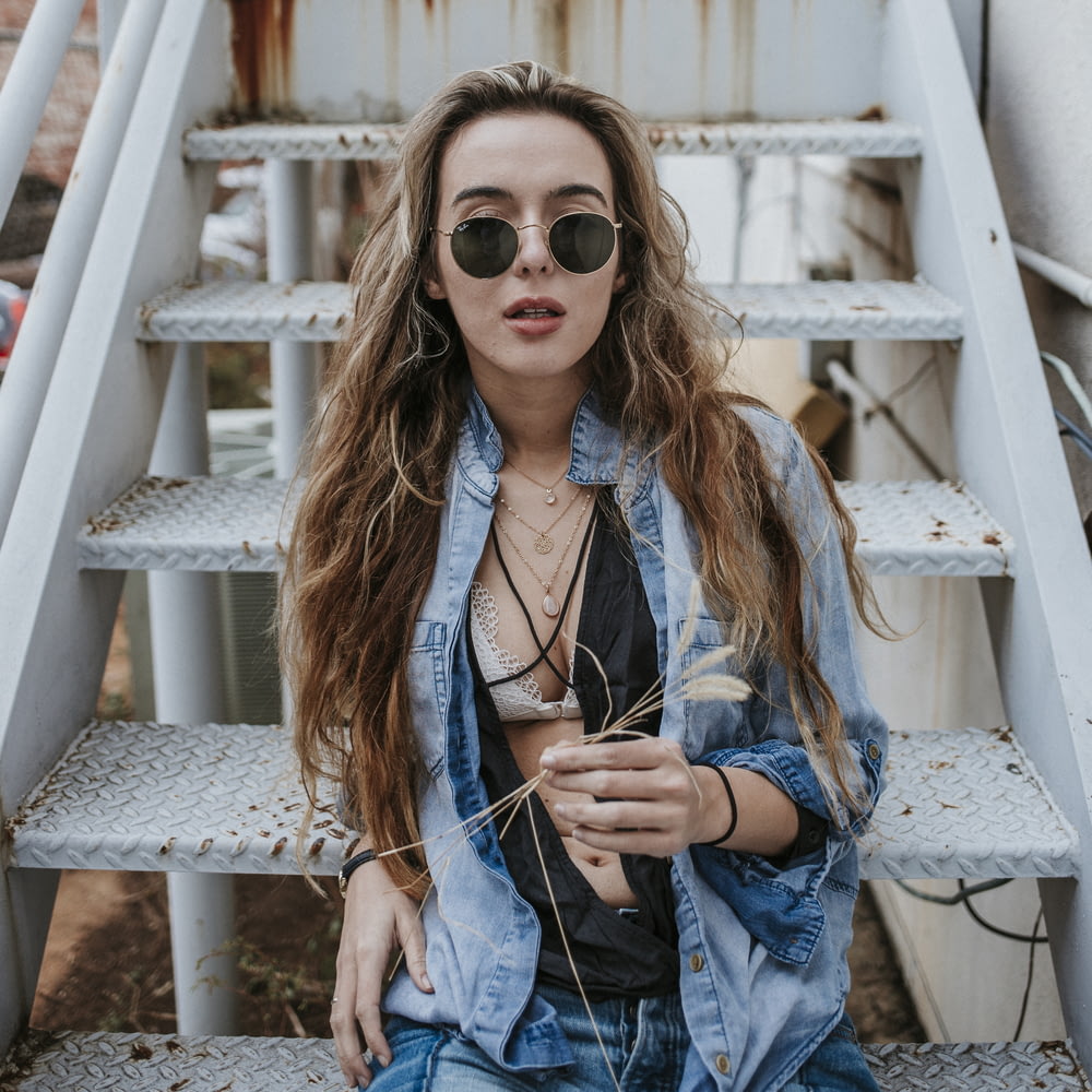 woman wearing black sunglasses on stairs