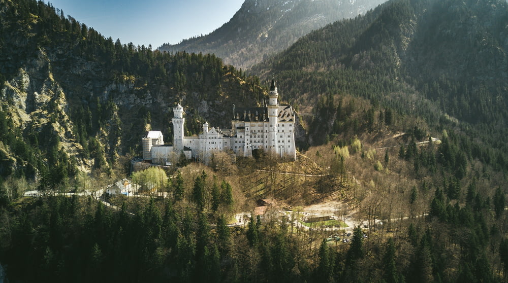 landscape photo of castle near the mountain