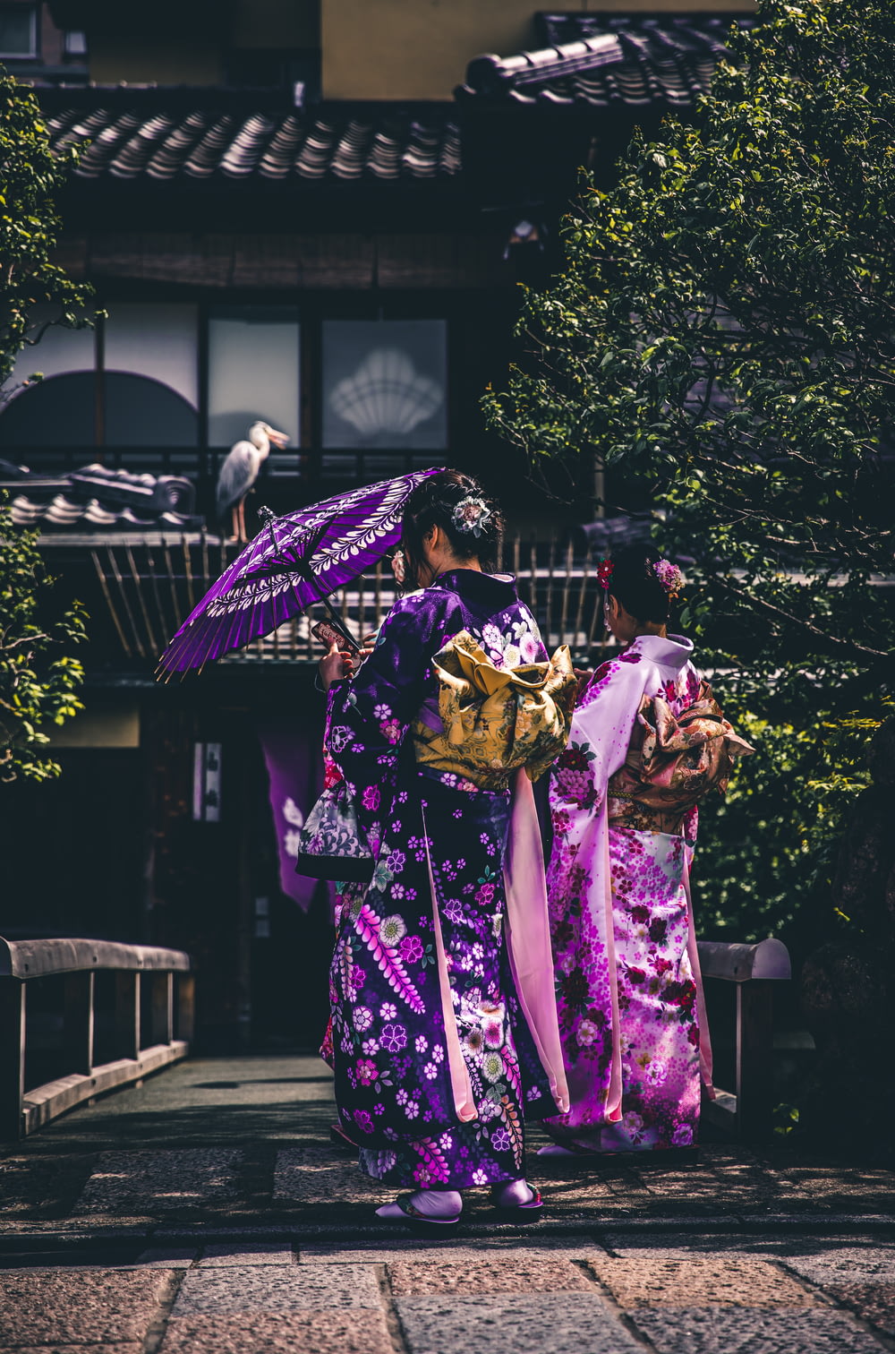 two women in purple and pink kimono