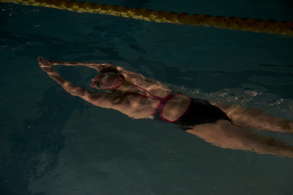 woman swimming on pool