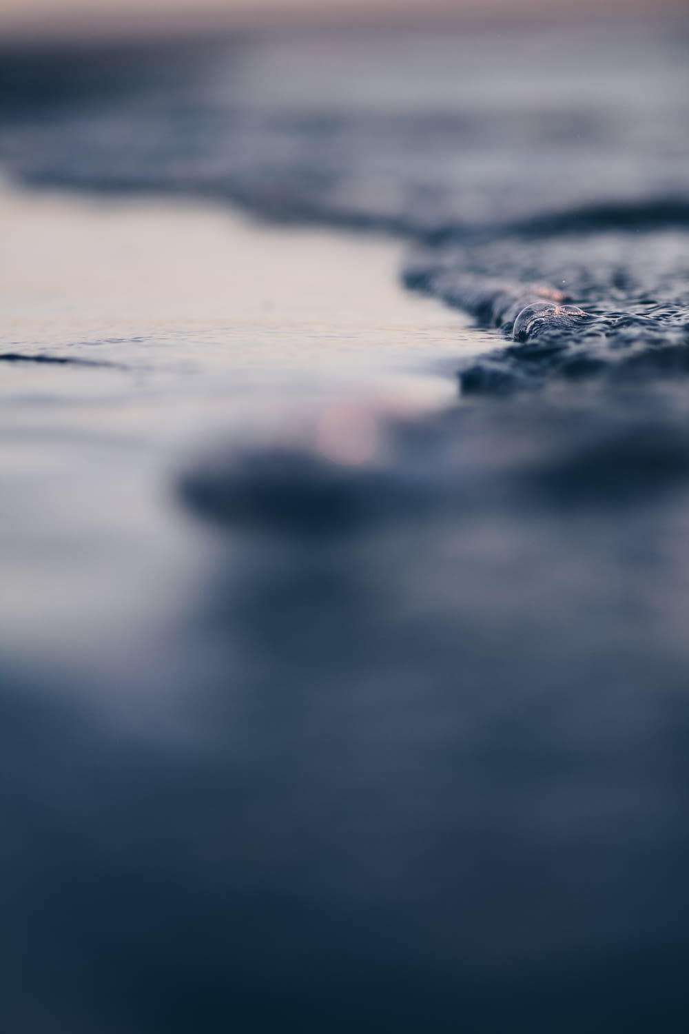 shallow focus photo of water wave