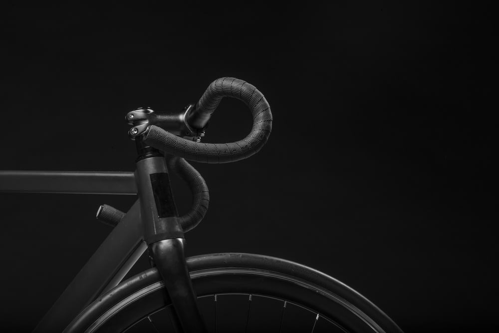 black road bicycle handle with black background
