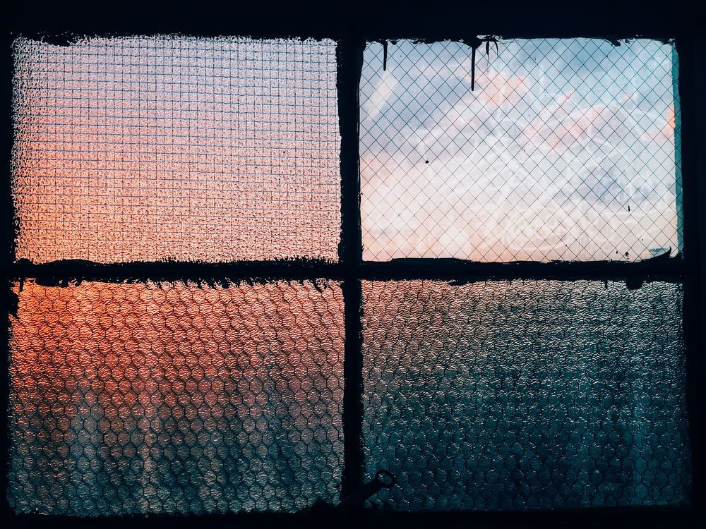 closeup photography of clear glass window closed