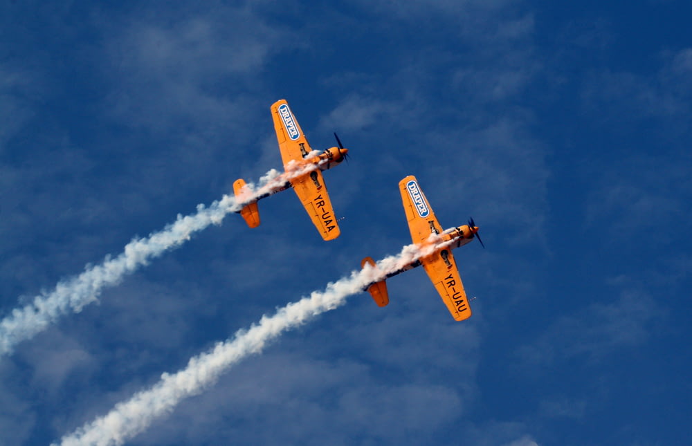 two orange jet planes
