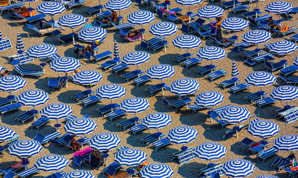 aerial photography of blue-and-white patio umbrellas