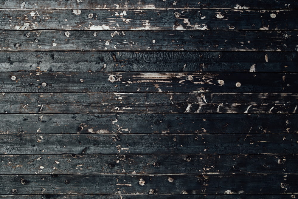 closeup photography of black wooden parquet partition