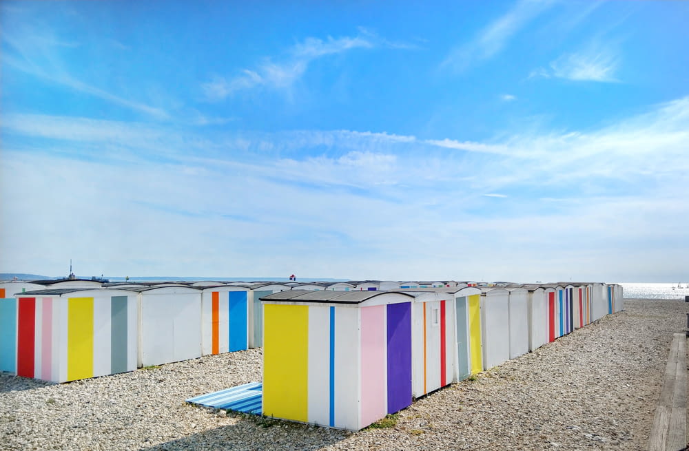 multicolored sheds near shore during day