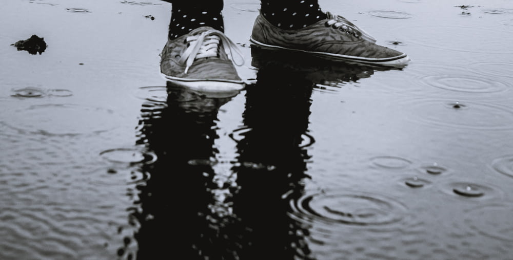 person standing on wet ground