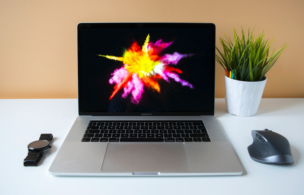 MacBook Pro showing purple illustration