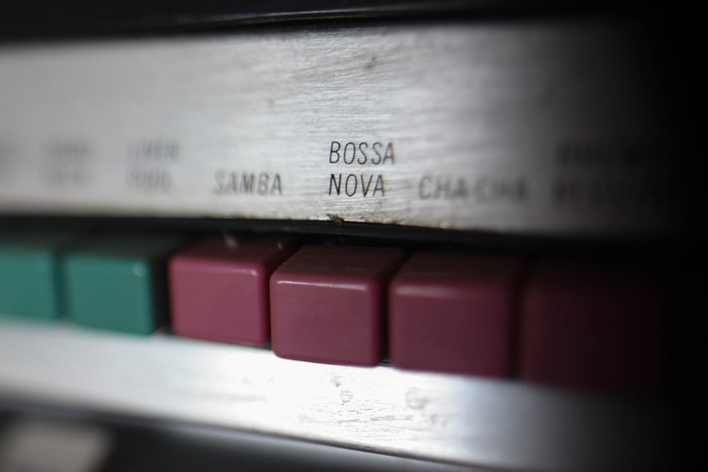 a close up of a keyboard with a red and green key