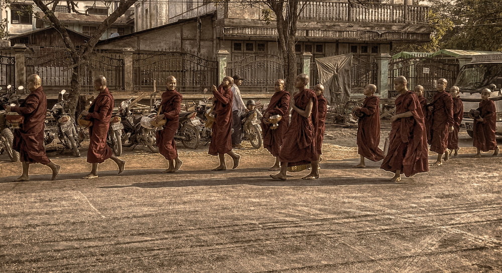 monks marching on street