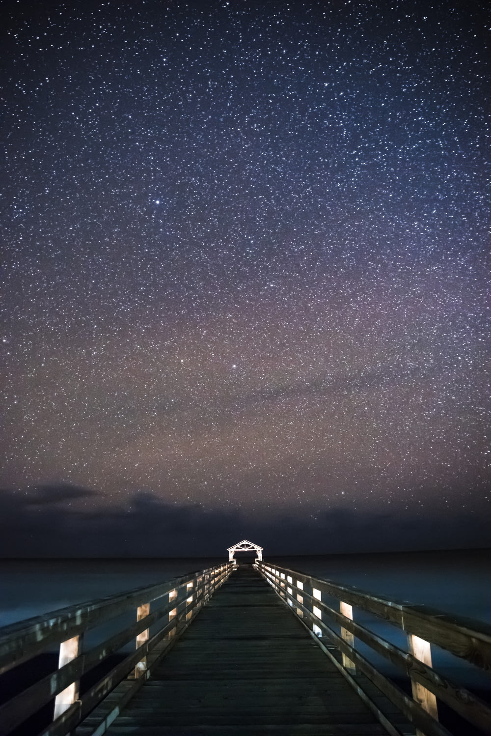 bridge under starry sky