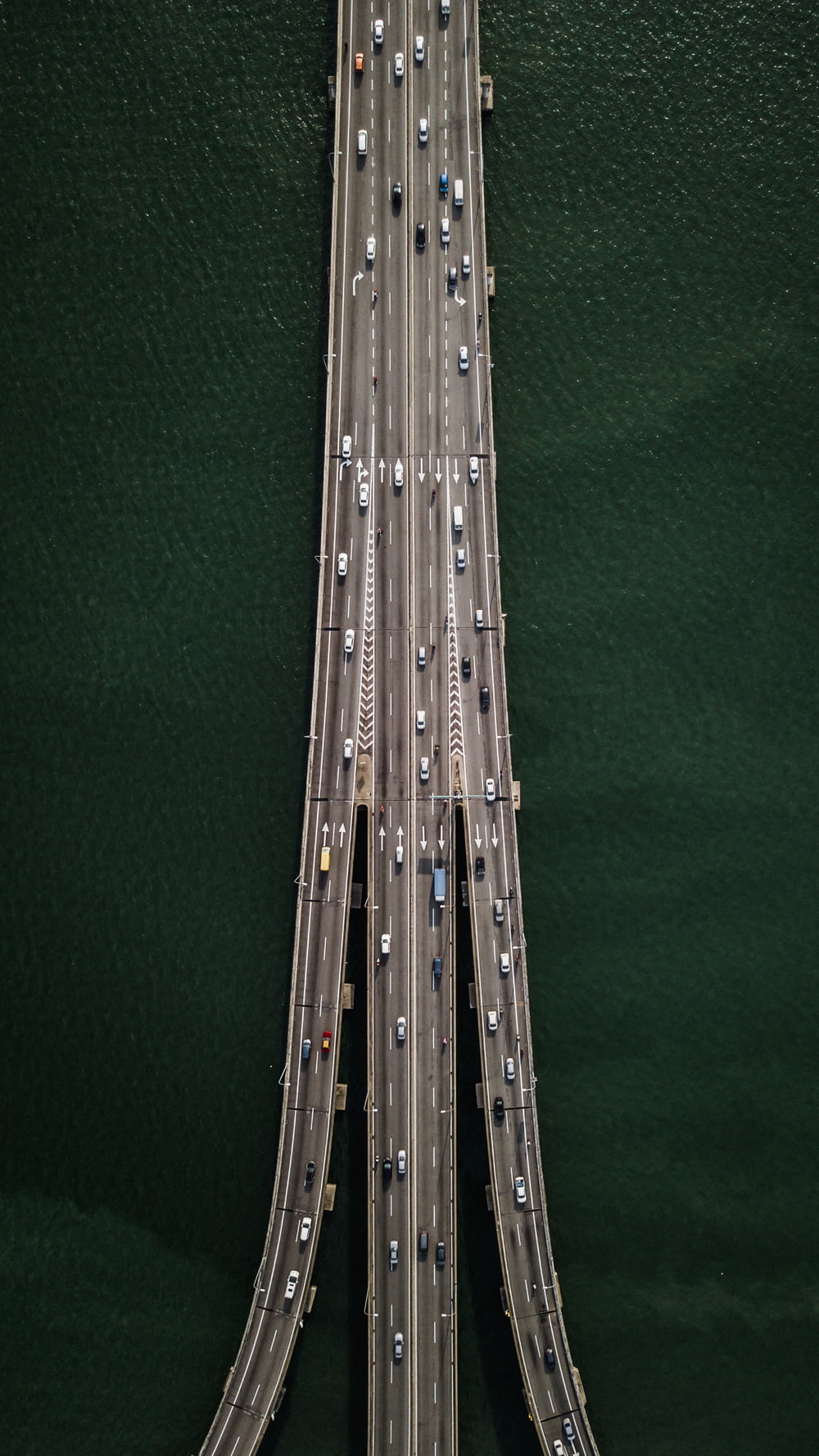 aerial view of bridge with cars crossing