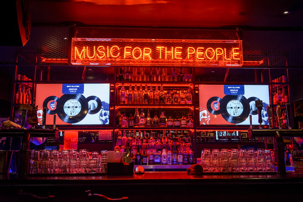 red music of the people neon-light signage