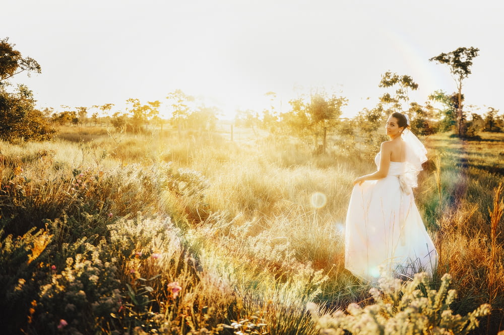woman in white gown on grassland
