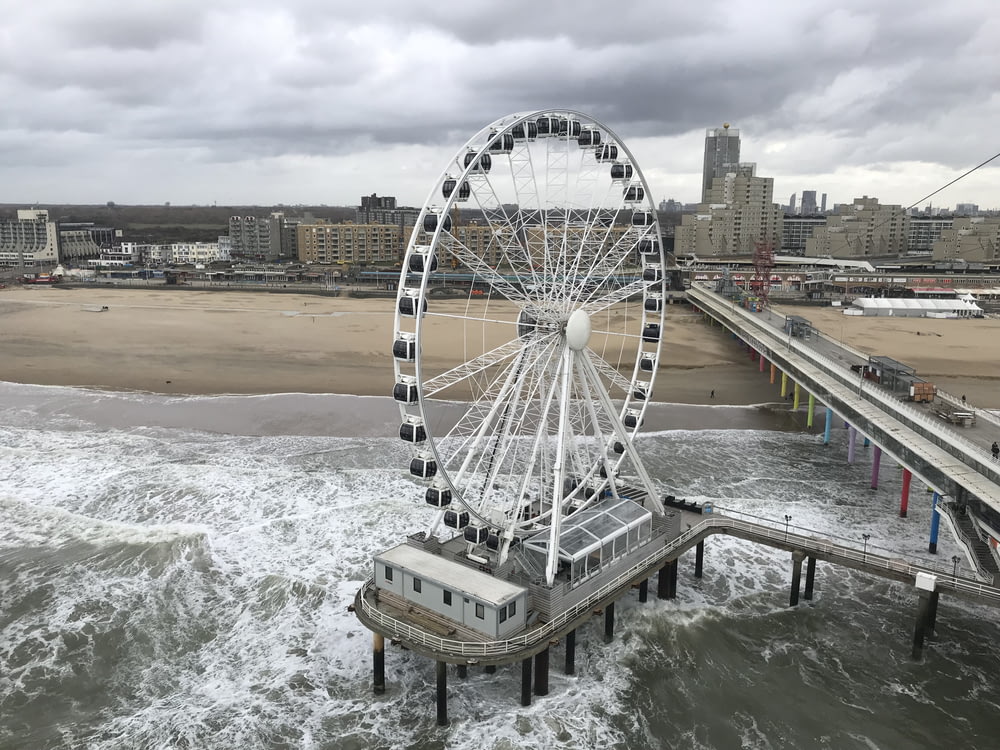 Ferris wheel on structure near beach