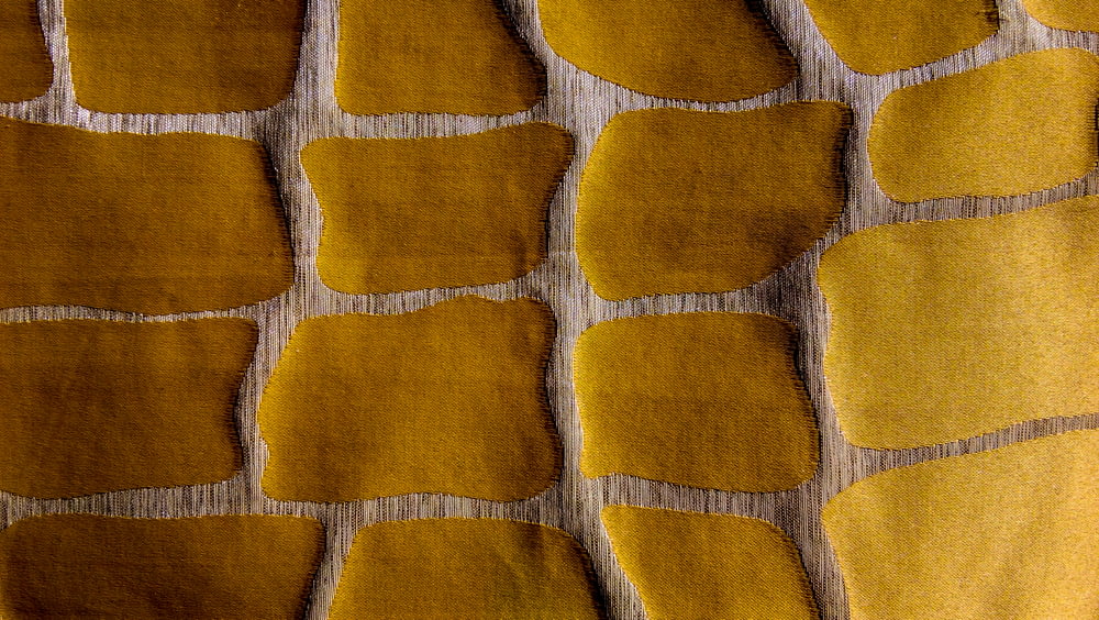 yellow and beown textile