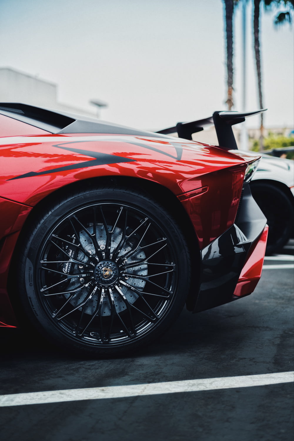 black and red Lamborghini Aventador SV rear left side