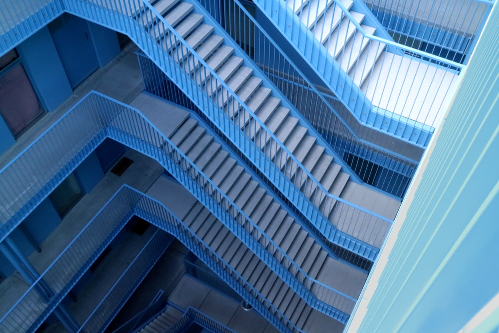 blue and gray stairs inside building
