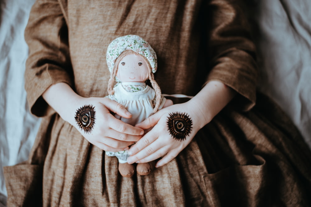 woman holding doll