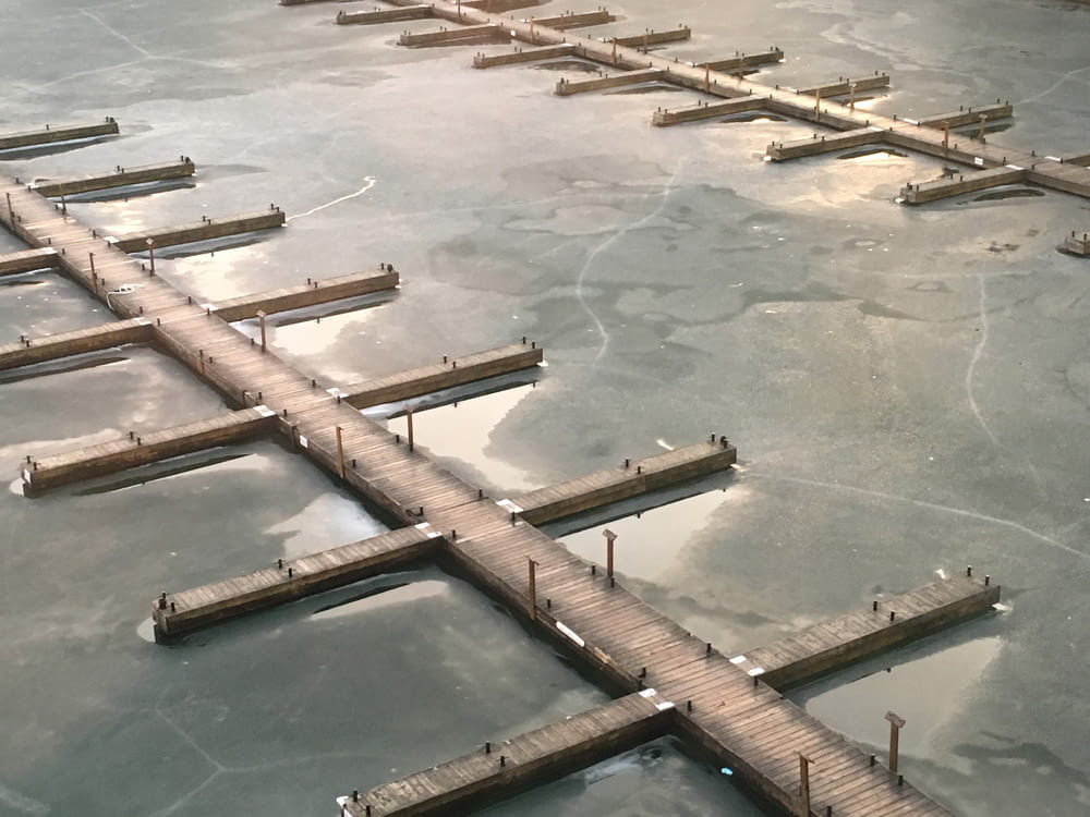aerial photography of brown wooden pier during daytime