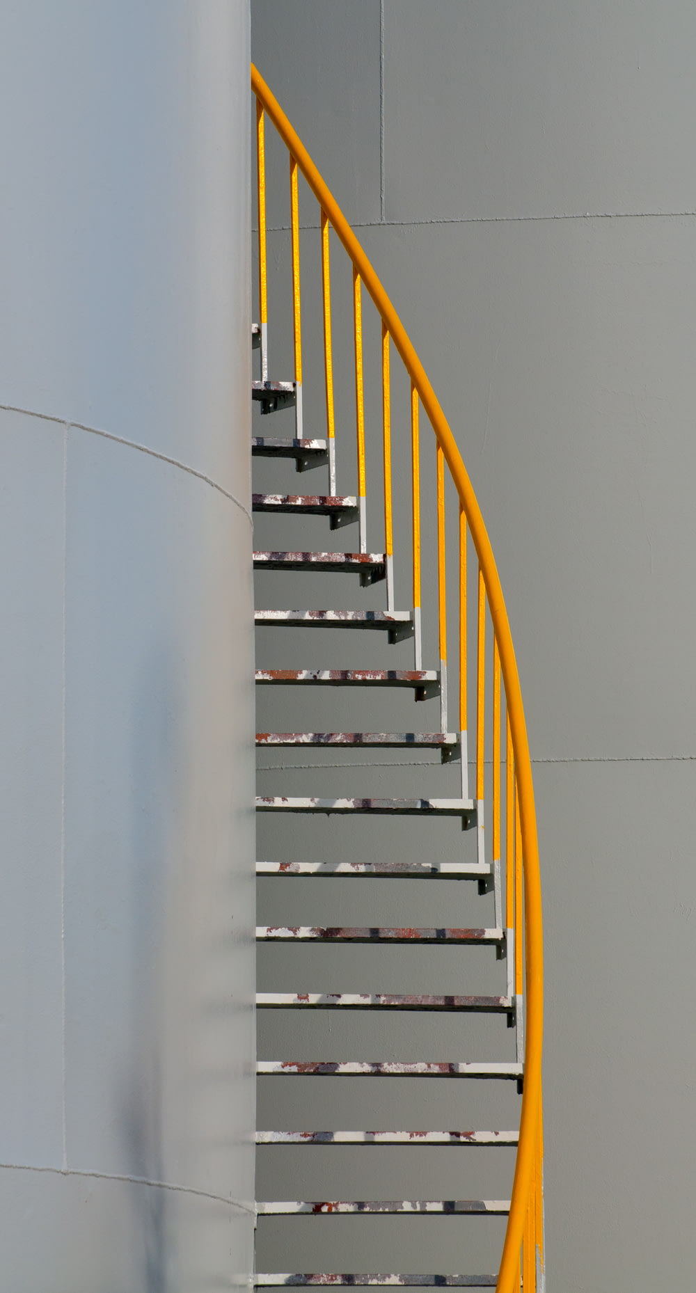 yellow and silver spiral staircase
