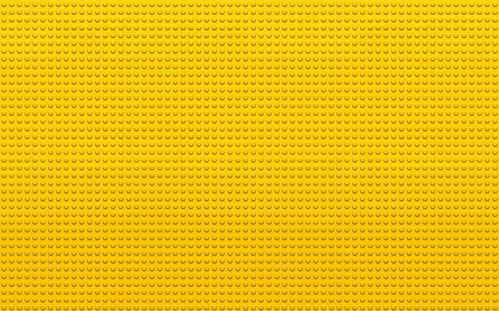 a yellow background with small dots