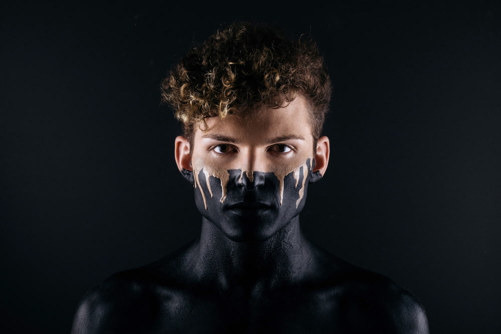 man with black body paint