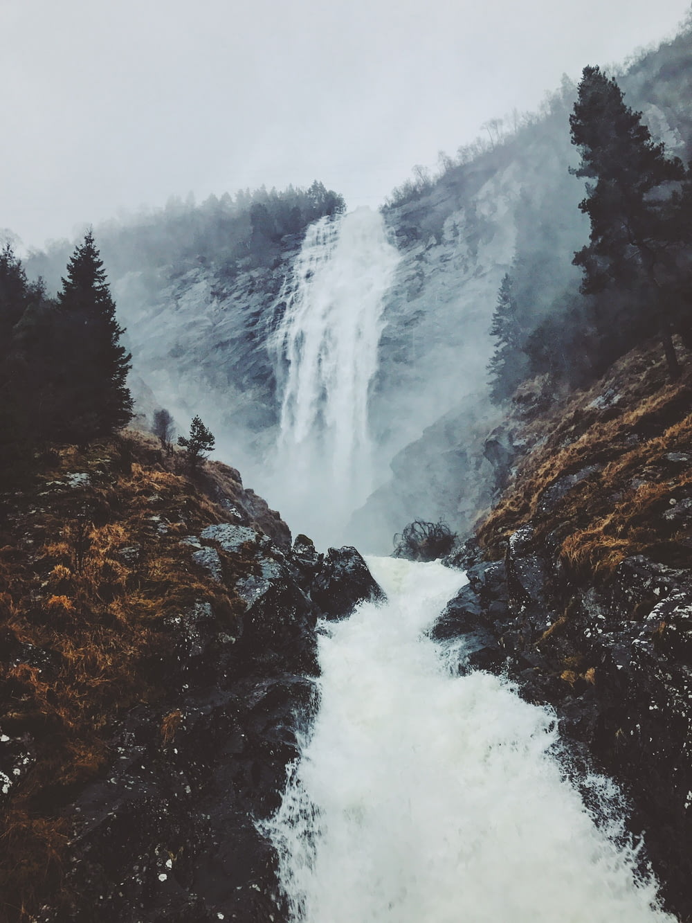 foggy mountain with falls