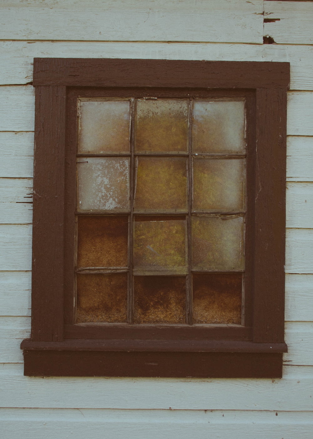 close up photo of square brown wooden window