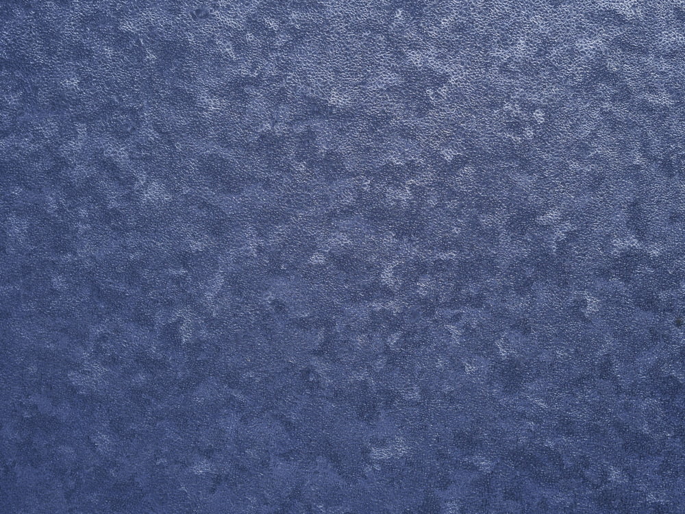 a close up of a blue wallpaper texture